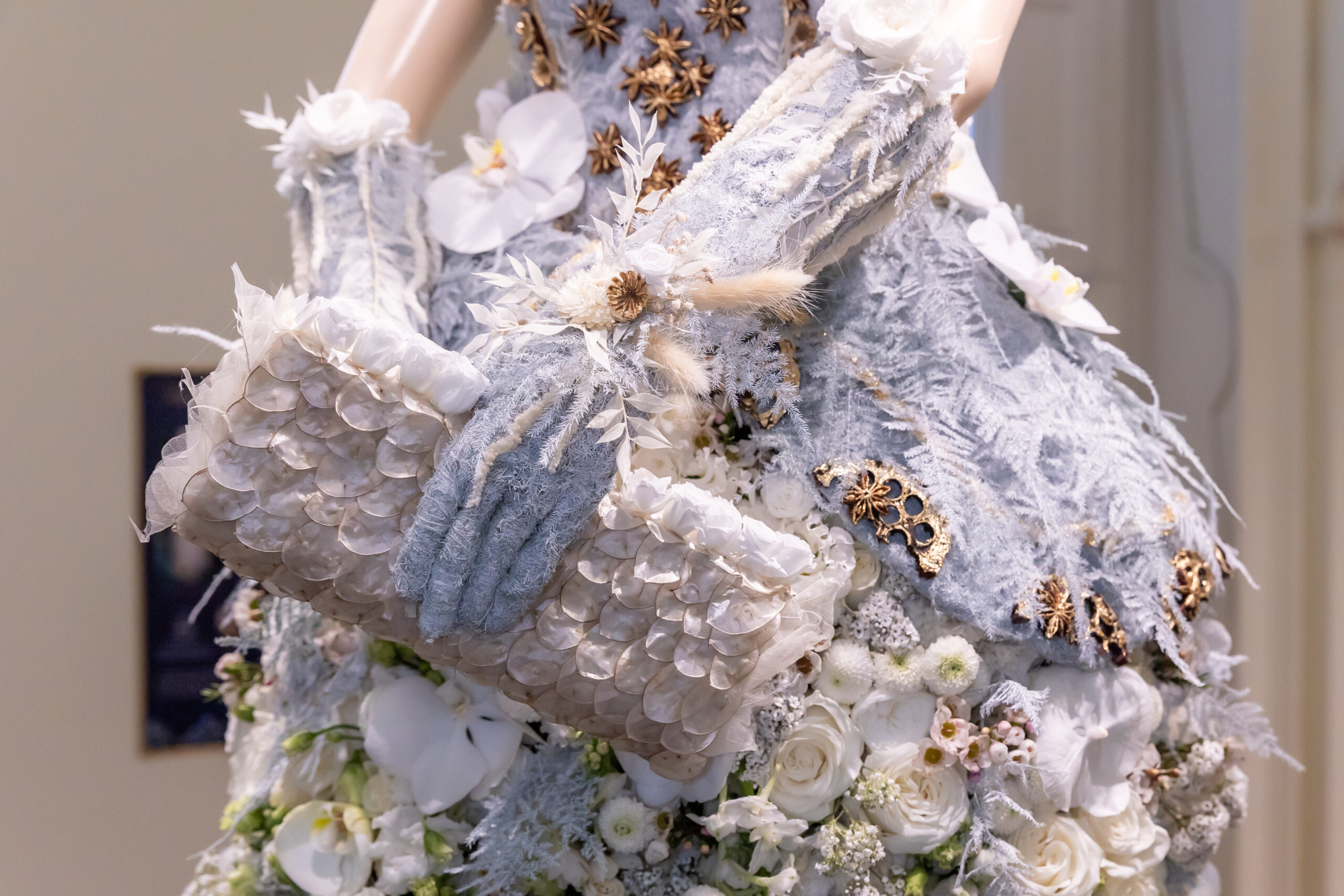 Close detail of the floral glove, handbag and gown on the BFA Fashion for a Cause mannequin